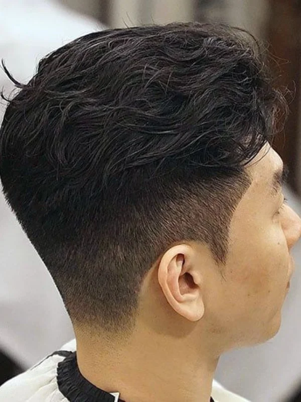 Undercut Fade: 17 Trending Haircut Variations for Men 11 Casual Messy Brush Back with Disconnected Undercut Fade