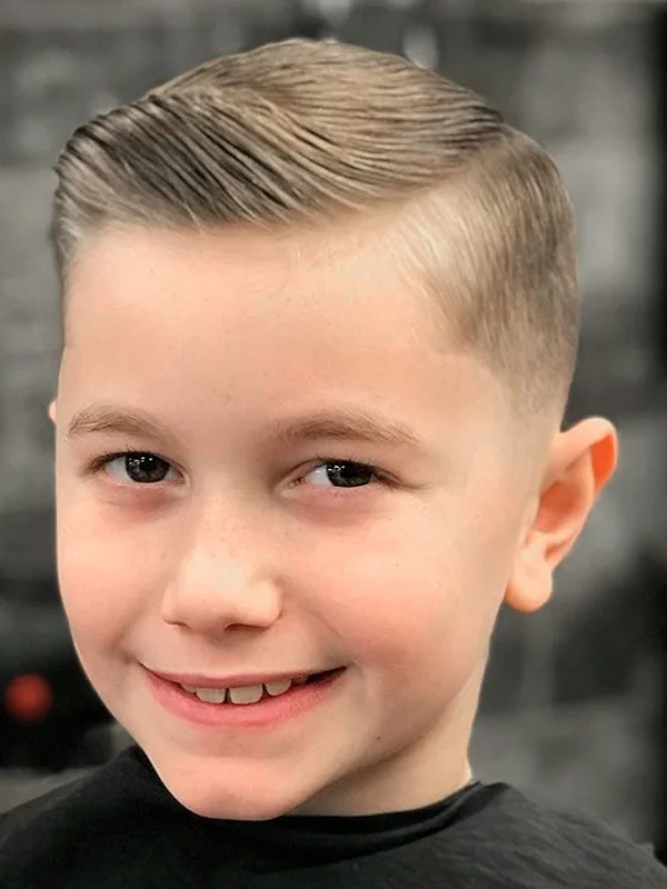 35 Cool & Stylish Kids Boy Haircuts 9 Hard Side Part with Taper Fade