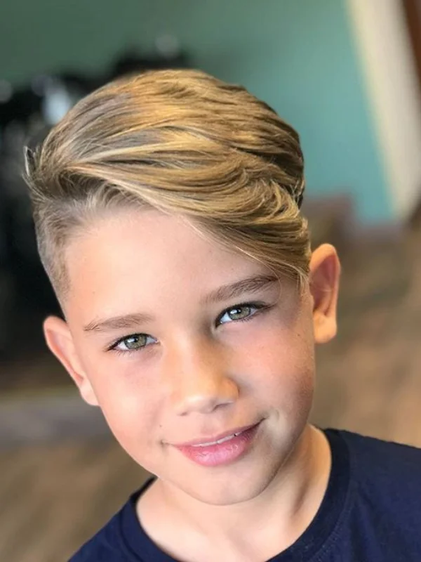 35 Cool & Stylish Kids Boy Haircuts 26 Long Side Part Fade with Design