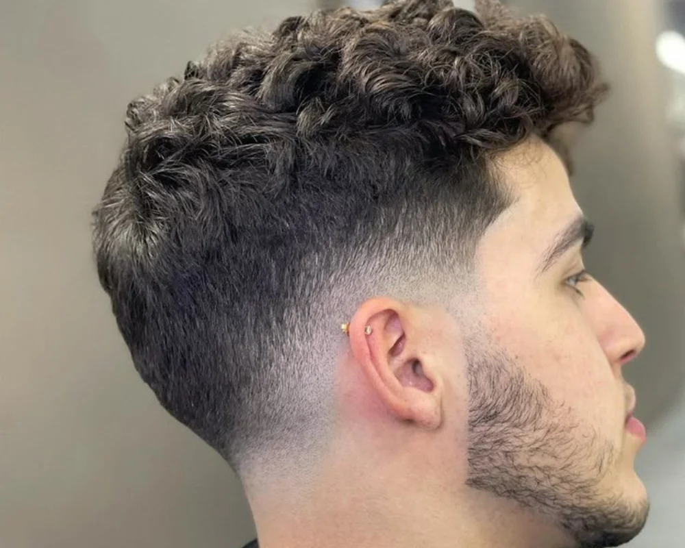 Boys Haircuts: 40 Cool & Stylish for Every Personality 34 Mid Fade with Curly Top