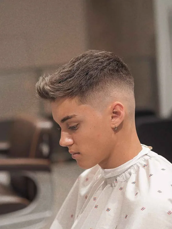 35 Cool Haircuts for Teenage Guys – Trendy & Fresh Styles 14 Modern Quiff with Mid-Low Skin Fade