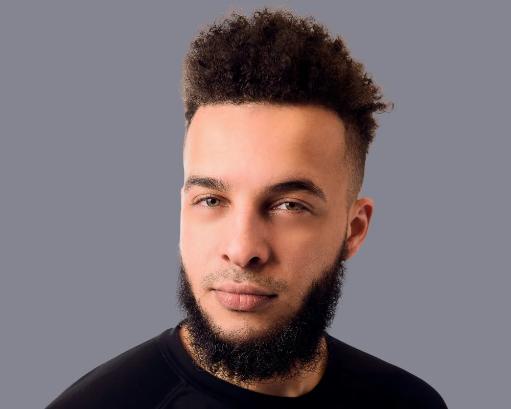 Fade Haircuts For Black Men: 23 Trendy Styles 2025 13 Short Afro Curls with Low Skin Fade