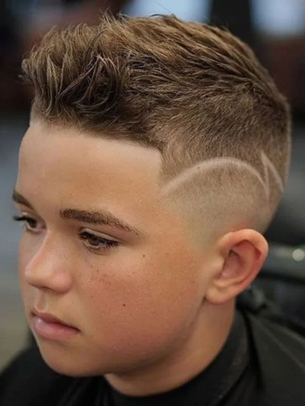 35 Cool & Stylish Kids Boy Haircuts 15 Side Spiky Hair with Mid Fade and Line Up