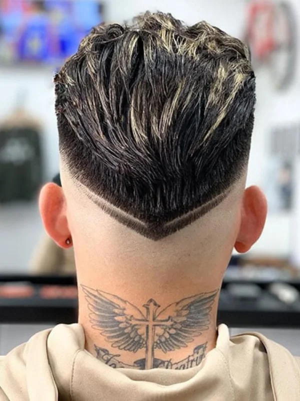 30 Cool Haircut Designs: Creative Ideas for Bold Looks 31 Stylish V-Shaped Cut with Artistic Design Work