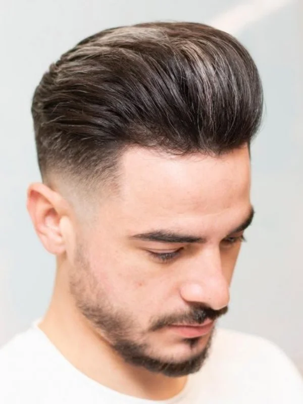 Undercut Fade: 17 Trending Haircut Variations for Men 16 Textured Pompadour with Undercut Drop Fade