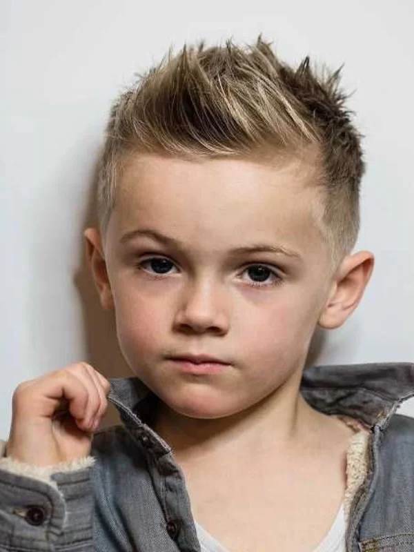 35 Cool & Stylish Kids Boy Haircuts 22 Textured Spiky Hair with Taper Fade