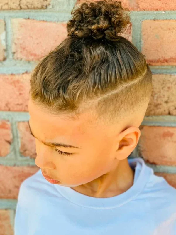 35 Cool & Stylish Kids Boy Haircuts 17 Top Knot with Mid Fade