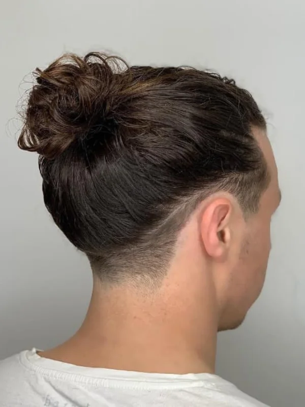Undercut Fade: 17 Trending Haircut Variations for Men 15 Trendy Man Bun with Low Temp Fade Undercut