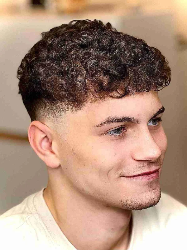 Low Taper Fade with Curls: 20 Fresh Style Ideas for Men 10 Defined Curly Low Taper Fade