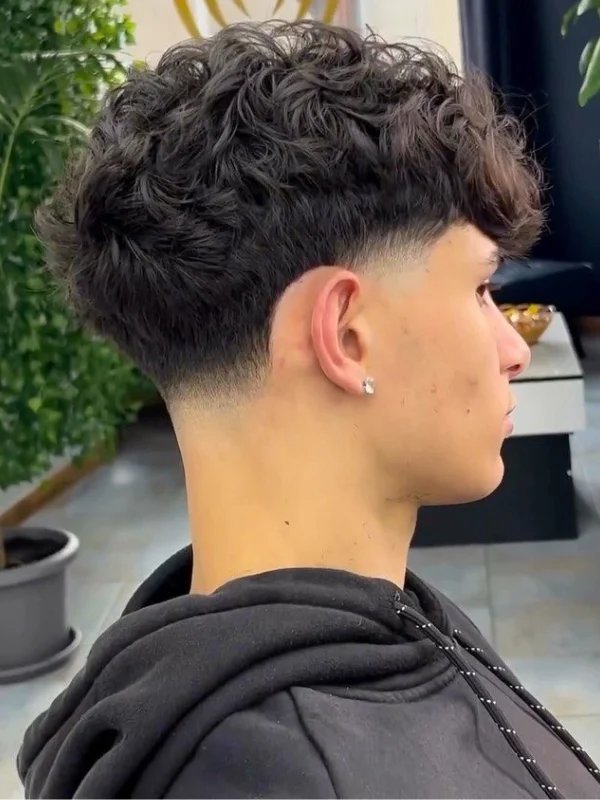 Low Taper Fade with Curls: 20 Fresh Style Ideas for Men 13 Low Taper Fade with Curly Fringe