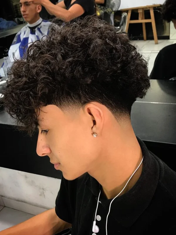 Low Taper Fade with Curls: 20 Fresh Style Ideas for Men 27 Low Taper Fade with Loose Waves